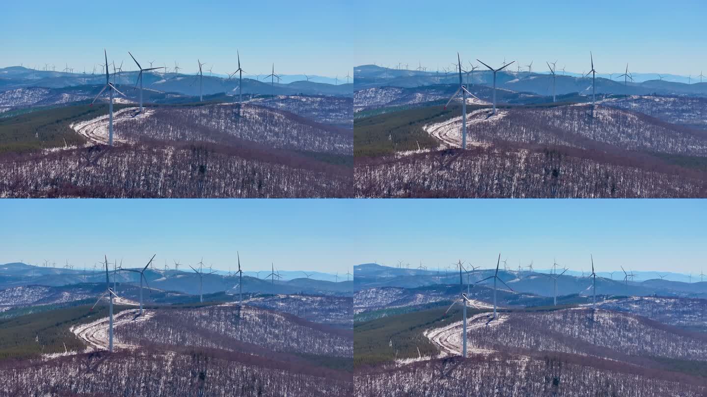 4k航拍河北承德雪后的塞罕坝林场风力发电
