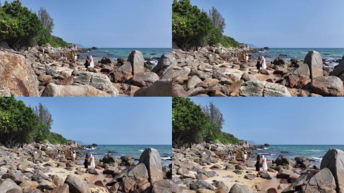 礁石上女生拍照