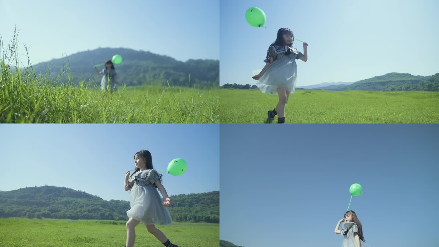 小孩草地奔跑放飞气球