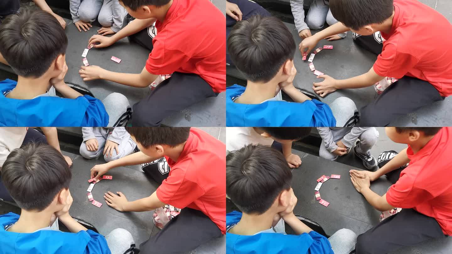 学生玩烟卡游戏