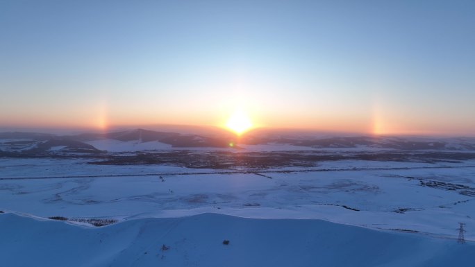 航拍雪域雪原灿烂夕阳