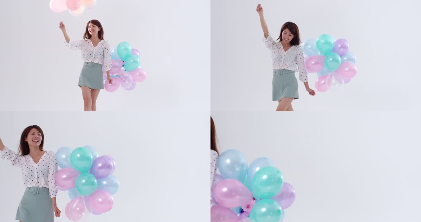 快乐的年轻女子拿着气球