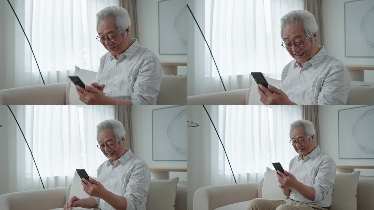 老年男子在家用手机视频聊天