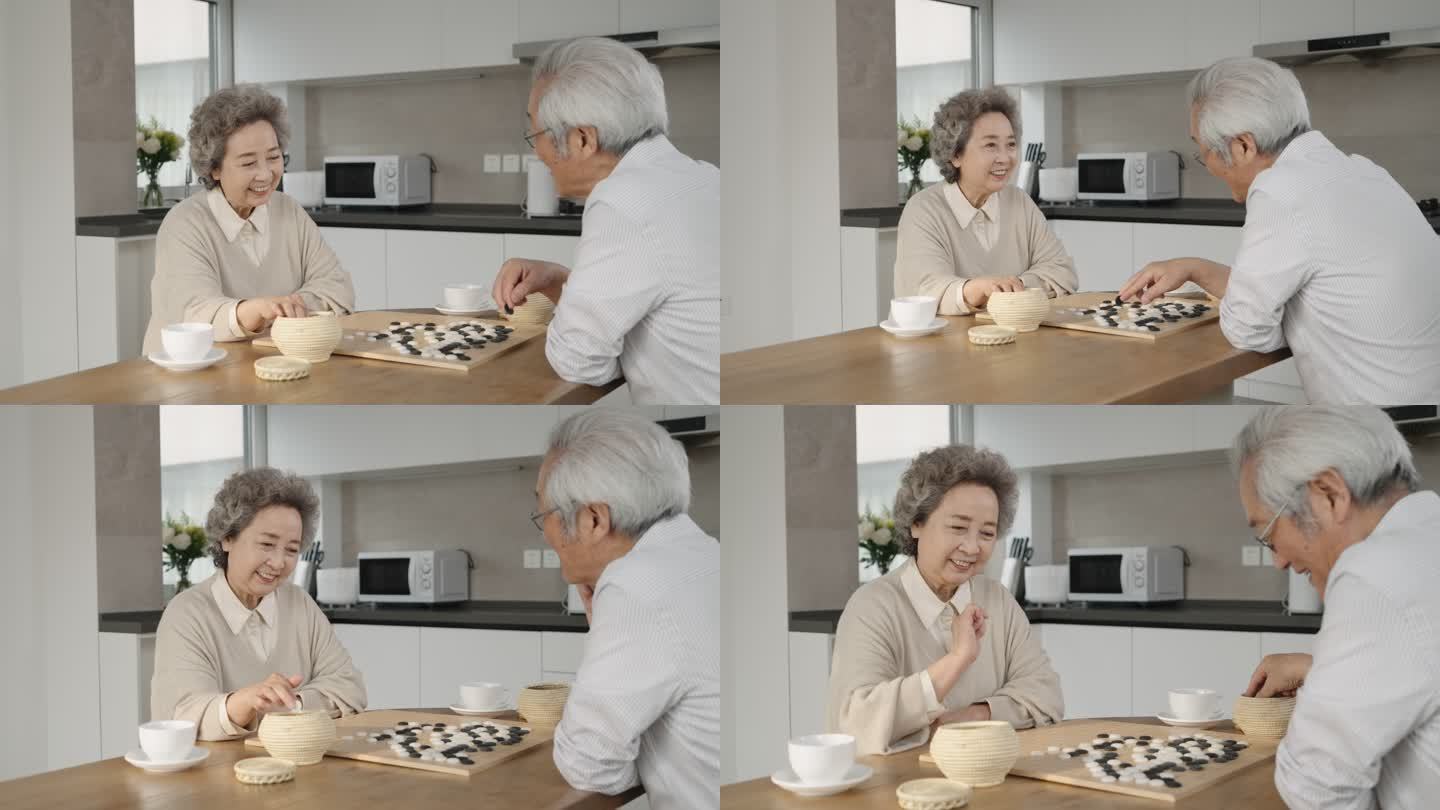 老年夫妇在家下围棋