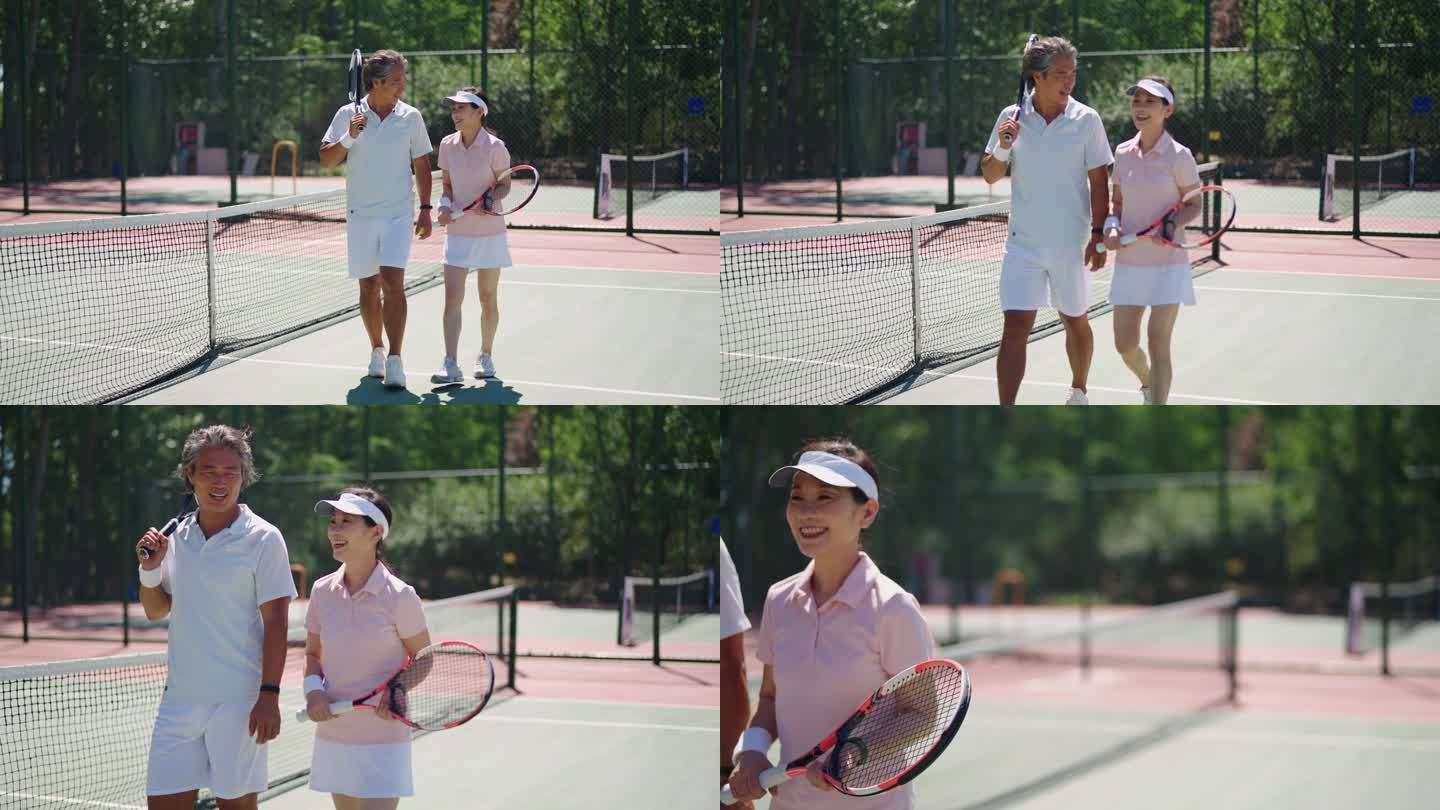 中年夫妇打网球