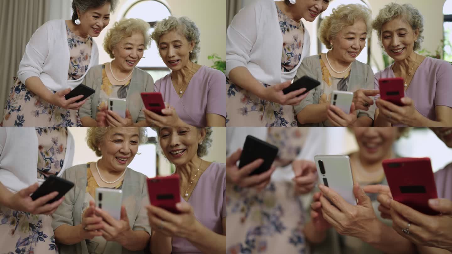 快乐的老年闺蜜在家使用手机