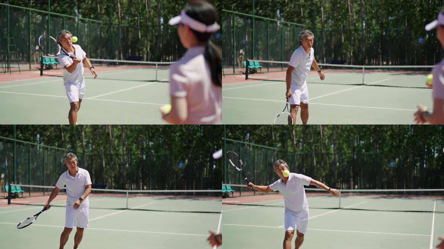 中年夫妇打网球