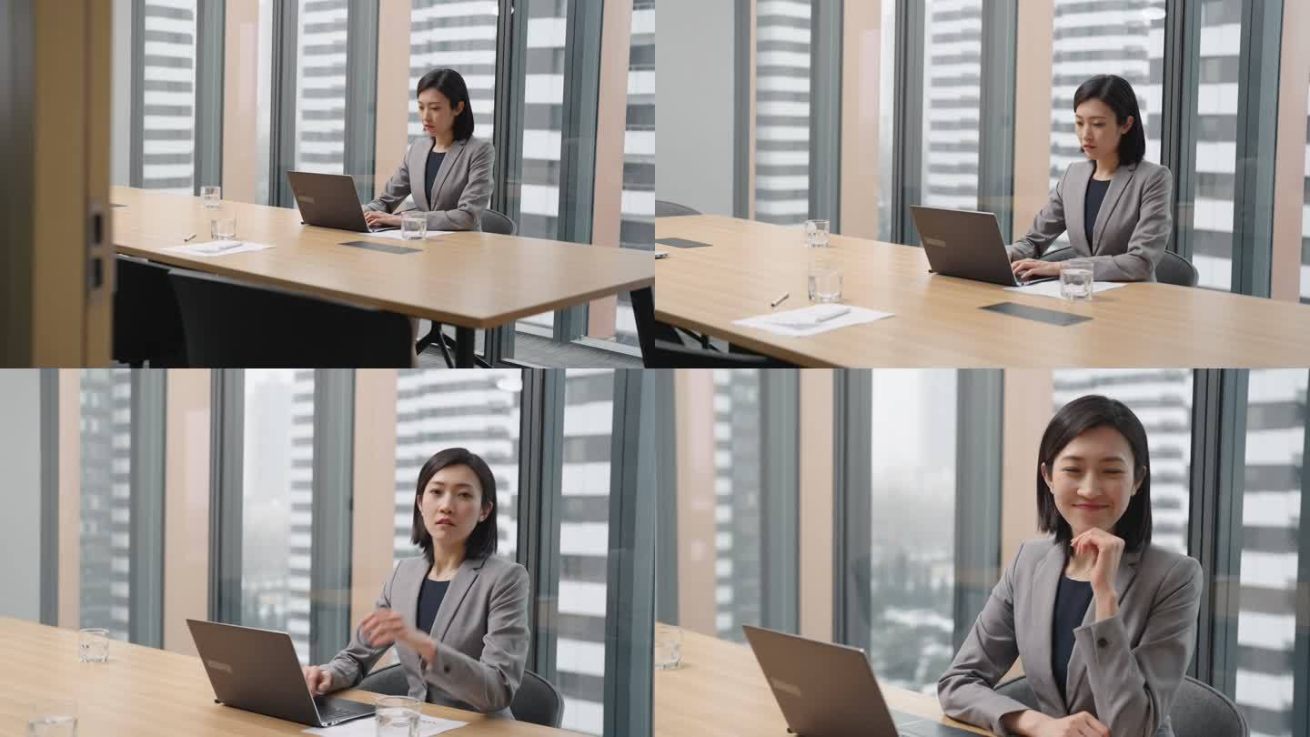 年轻商务女子在会议室使用笔记本电脑