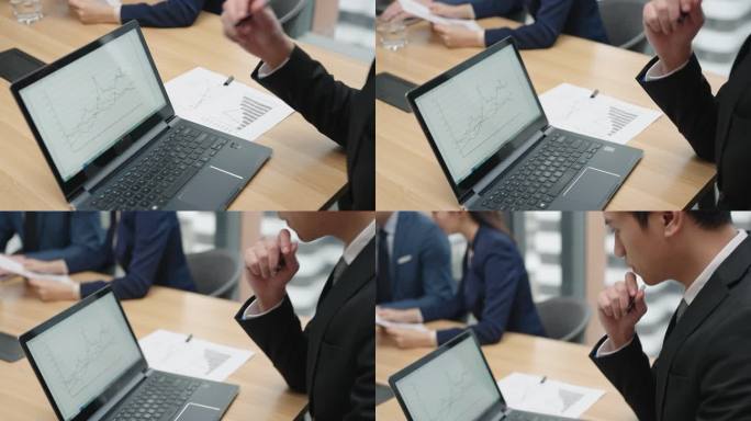 年轻商务男子在会议室使用笔记本电脑