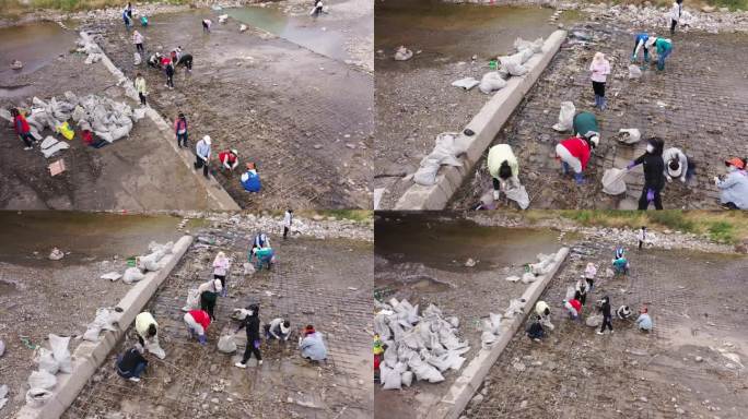 航拍社区工作人员人力清理河道垃圾