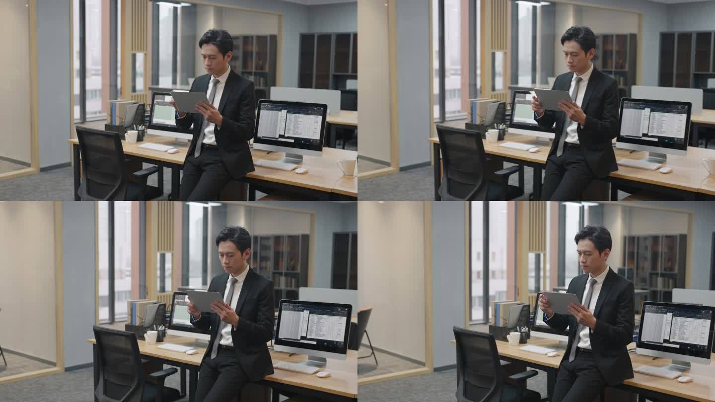 年轻商务男子在办公室使用平板电脑