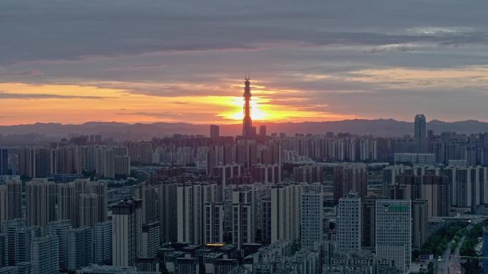 成都最高楼蜀峰468在朝霞中与太阳光结合