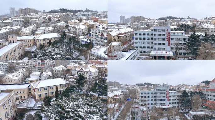航拍青岛雪景建筑鸟瞰医院大楼冬季雪景航拍