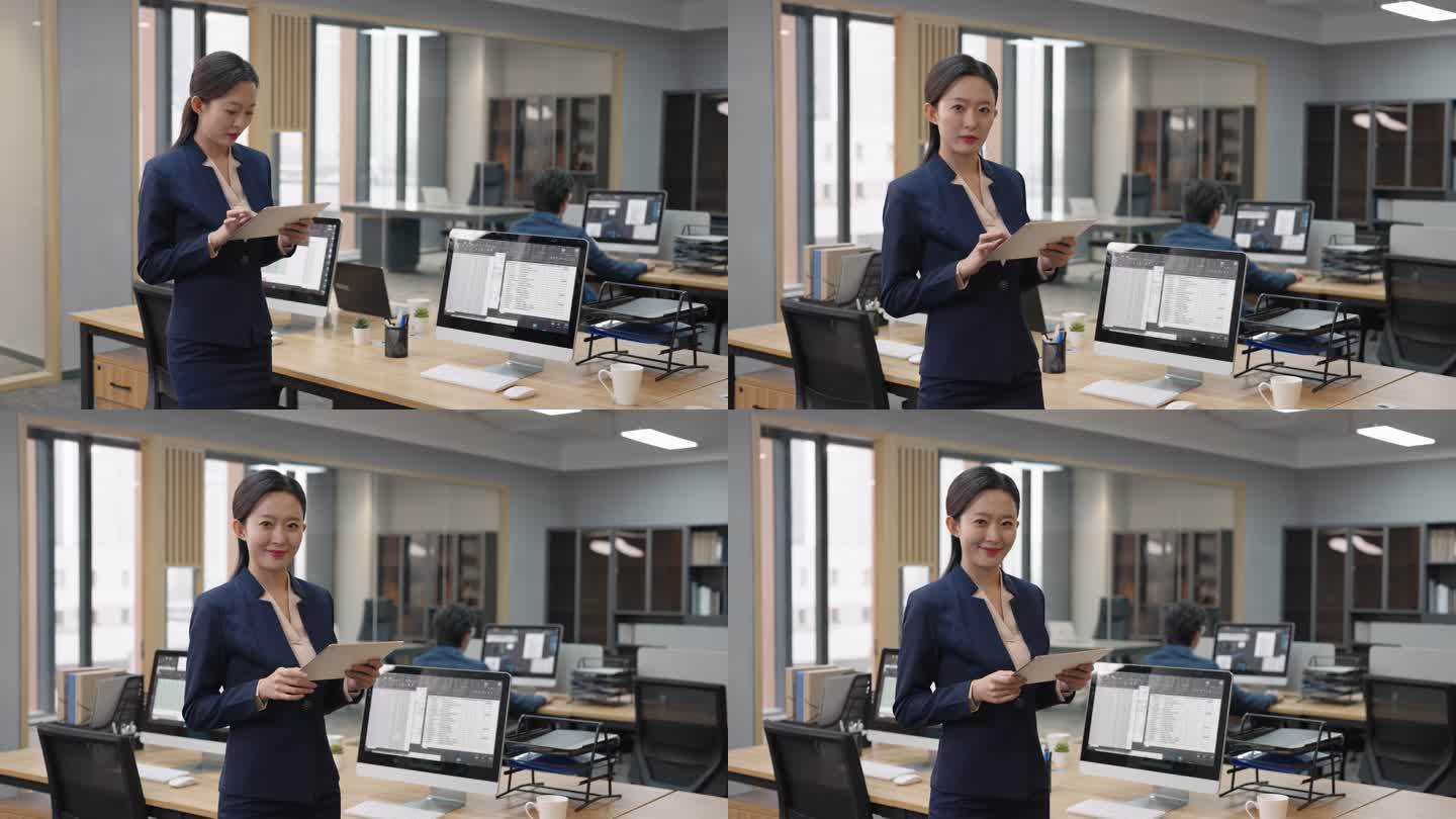 年轻商务女子在办公室使用平板电脑