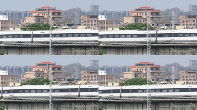 和谐号高速列车快速驶过城市高架桥