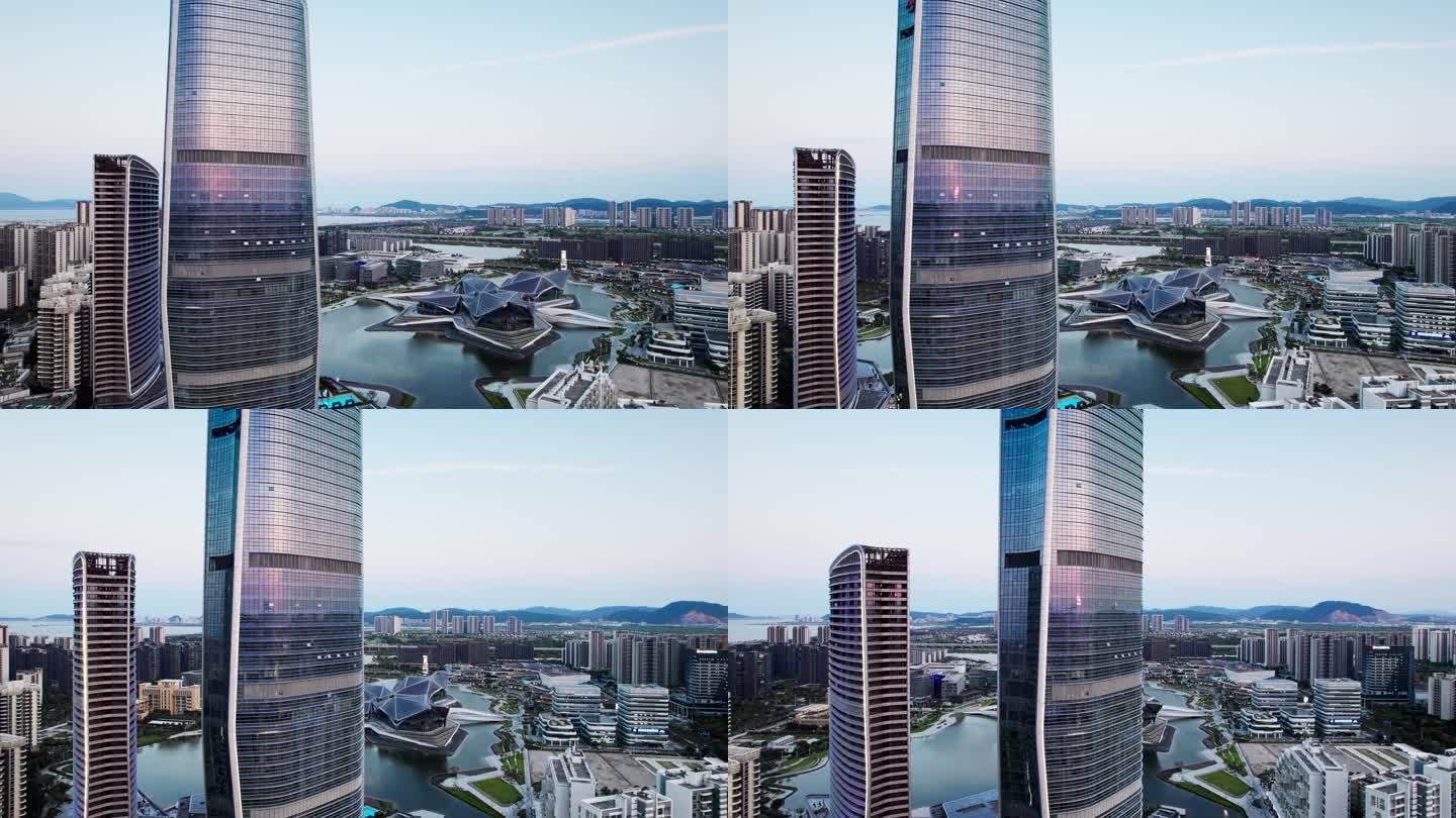 无人机在城市高楼外面环绕镜中反射夕阳