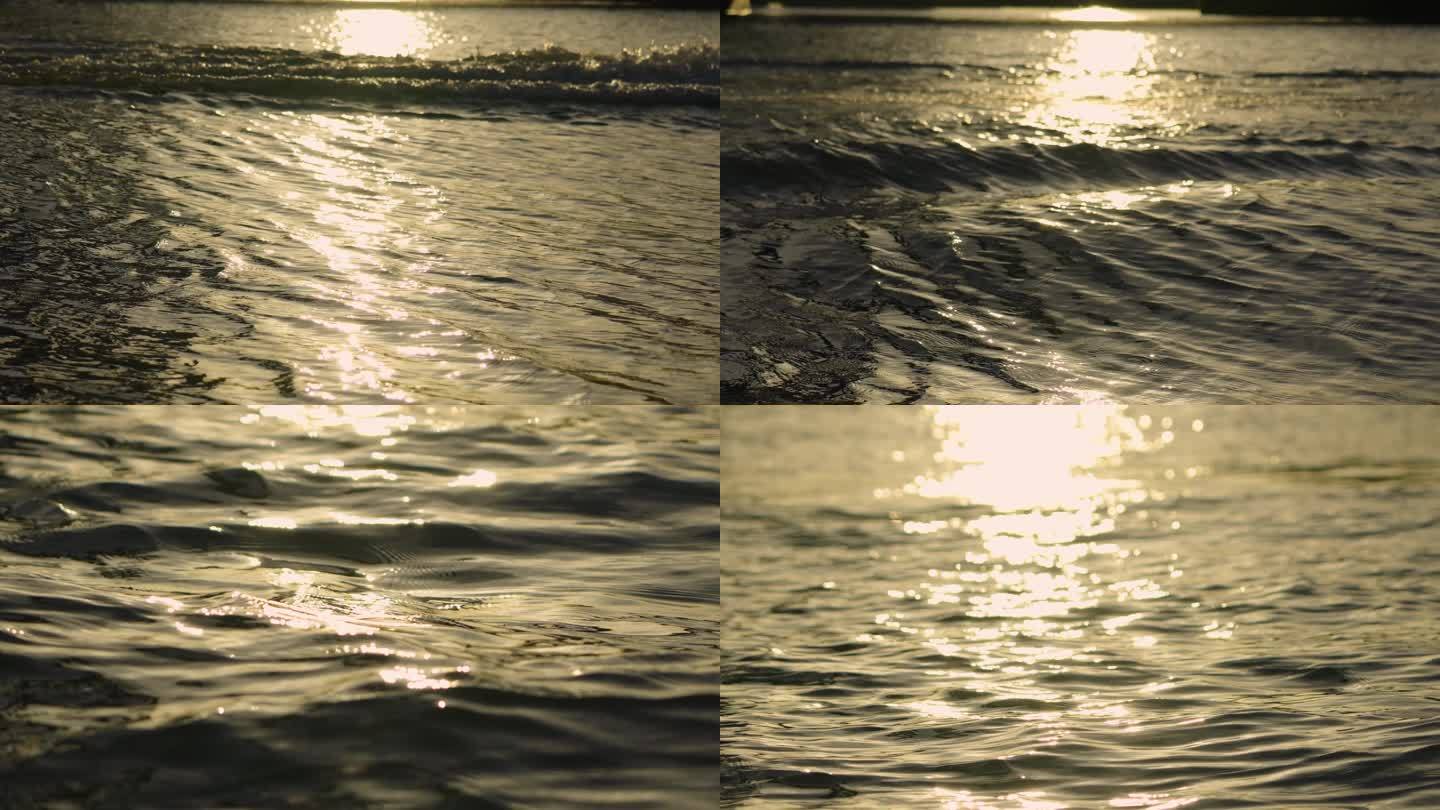 夕阳黄昏游船驶过波浪翻滚视频素材