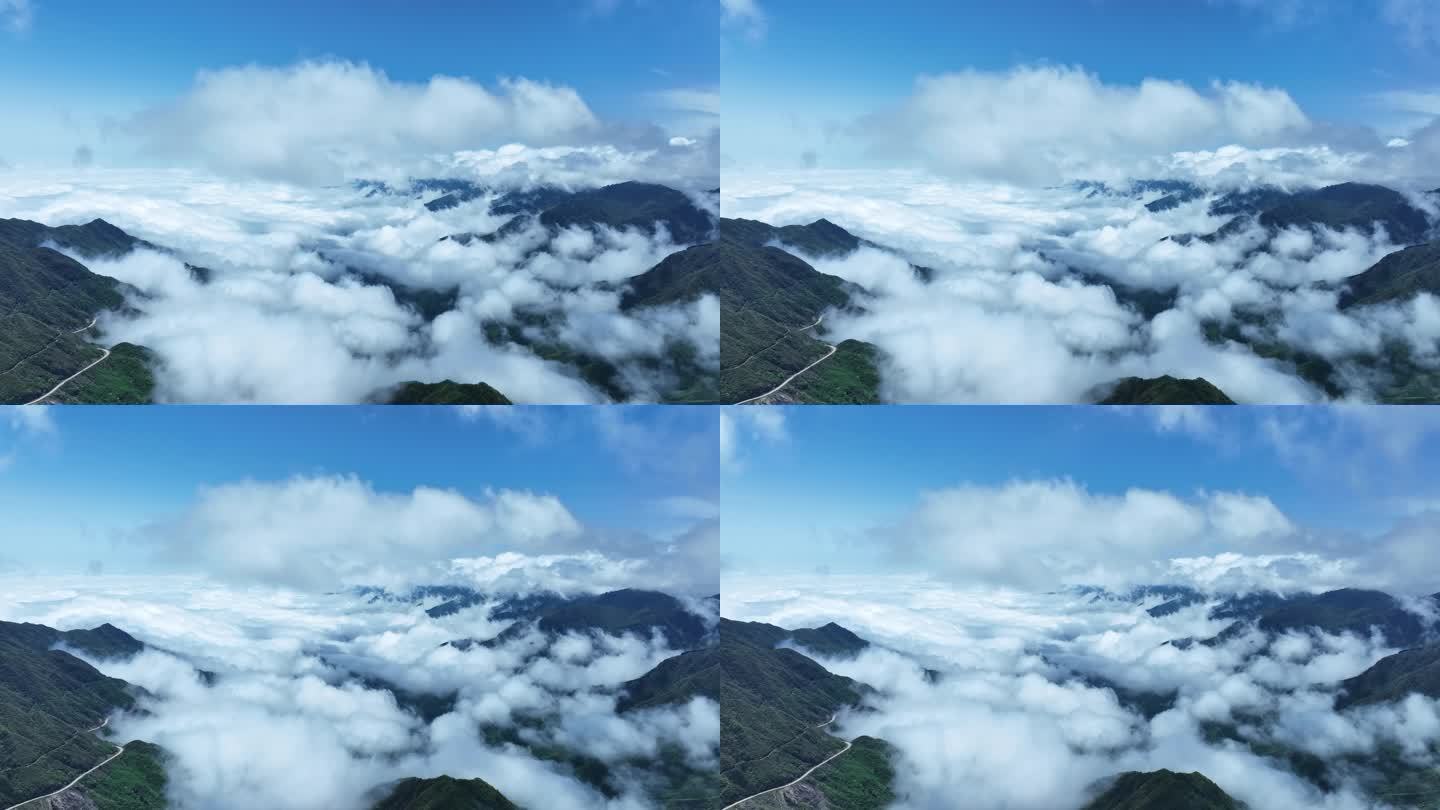 蓝天白云阳光下桂林高山上的云海和风力发电