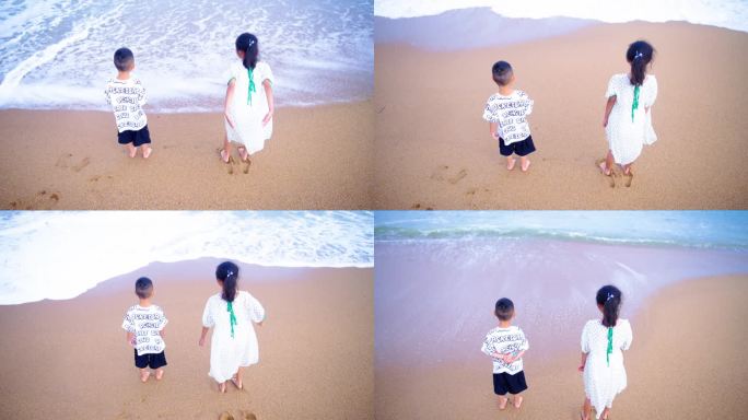小孩站在海边沙滩上
