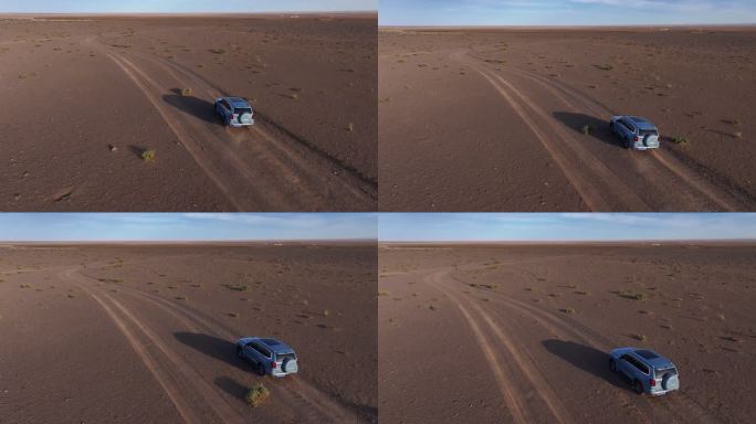 越野车行驶在荒漠戈壁无人区航拍