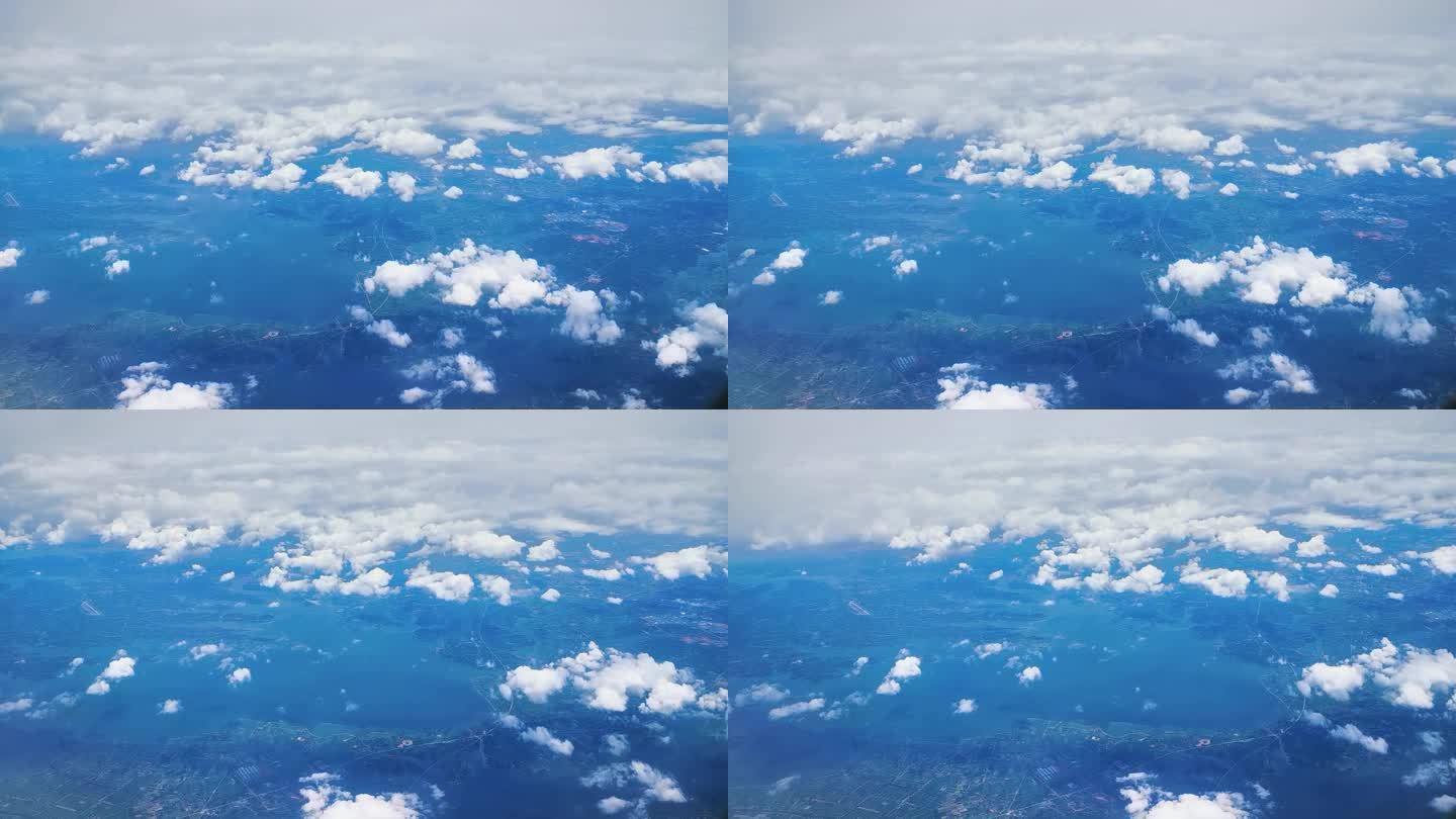 飞机上穿过云层俯拍四川盆地