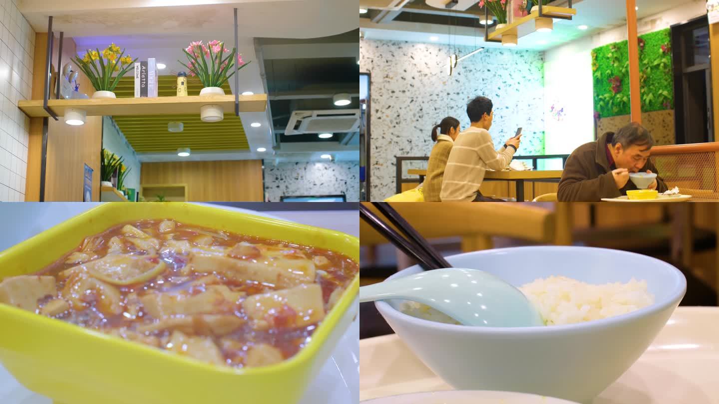 顾客在顺旺基快餐饭店餐厅用餐