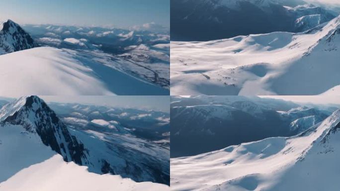 大气穿越飞跃雪山山脉航拍