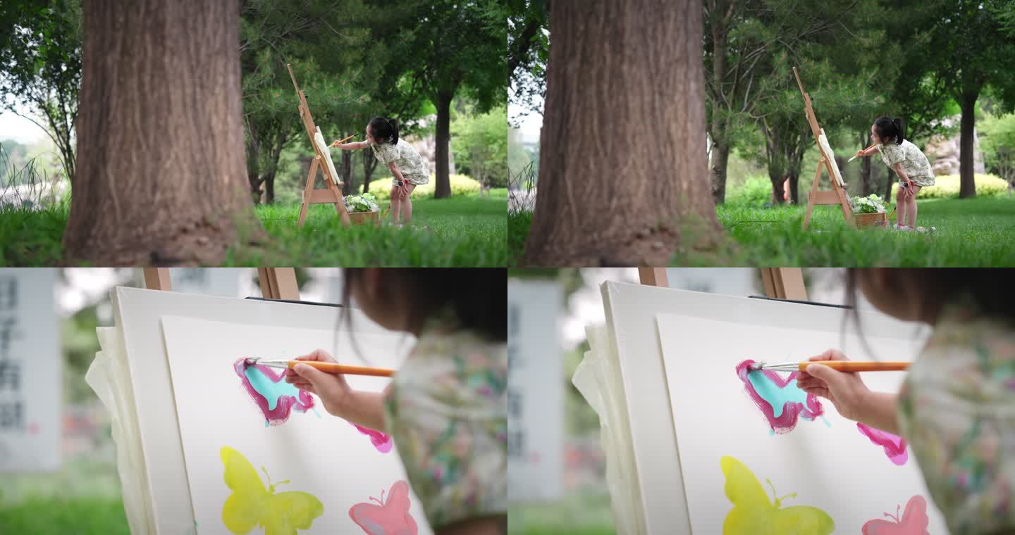 草地上小女孩画画蝴蝶