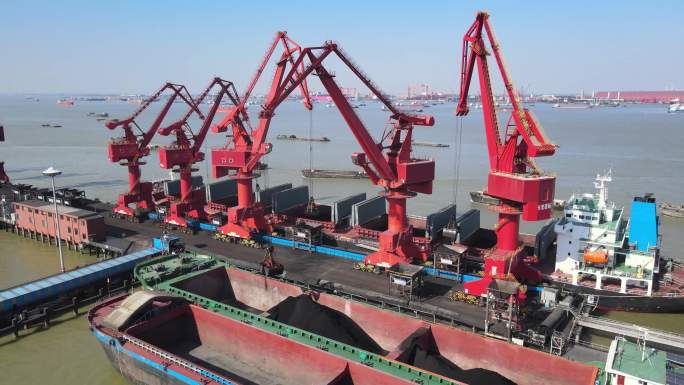 航拍长江码头红色吊机群装卸货作业