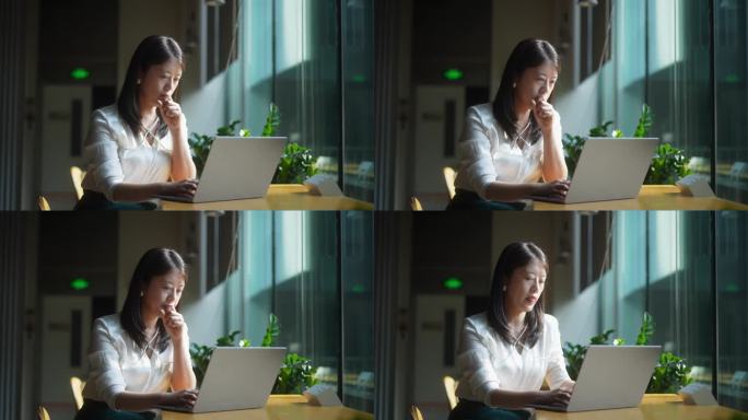 商务女性使用笔记本电脑