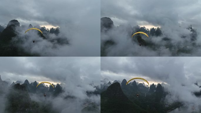 动力滑翔伞在云雾中飞跃桂林山水