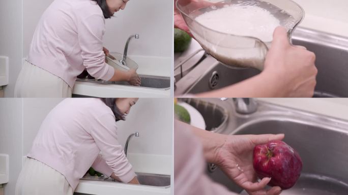 女人在厨房做饭淘米洗水果 辛勤劳动