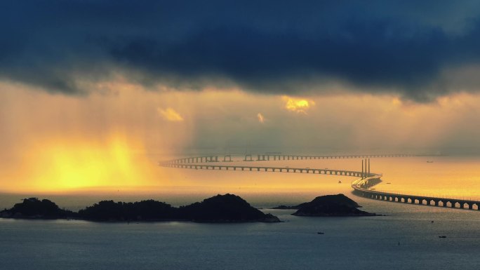 航拍珠海港珠澳大桥日出金色雨幕素材
