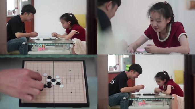 父亲和女儿下棋陪伴孩子下棋亲情益智游戏
