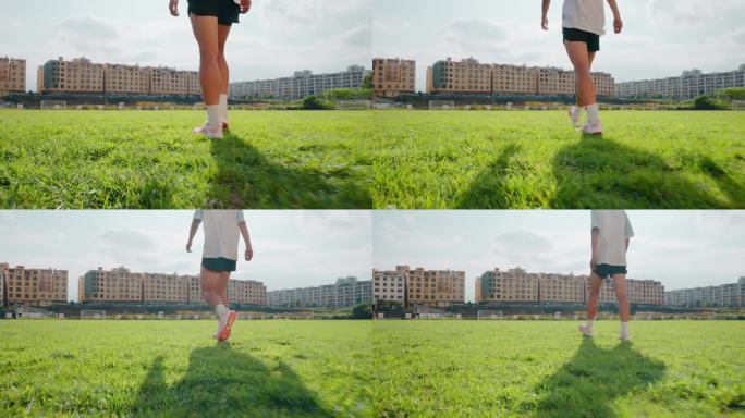 学校宣传足球场学生脚踩草地行走升格视频