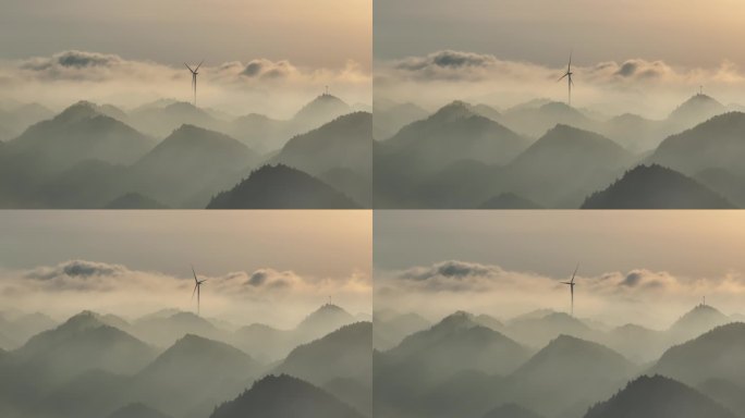 航拍清晨山顶上日出云海时间的风力发电风车