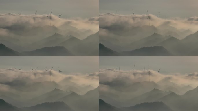 航拍清晨山顶上日出云海时间的风力发电风车