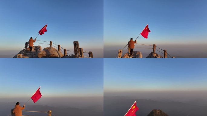 航拍青年手持红旗山峰峰顶挥舞红旗迎风飘扬