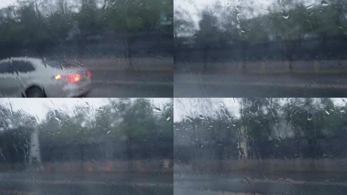 下雨中行驶的车窗玻璃