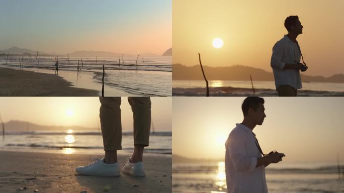 男人清晨海边散步拍照大海金色阳光