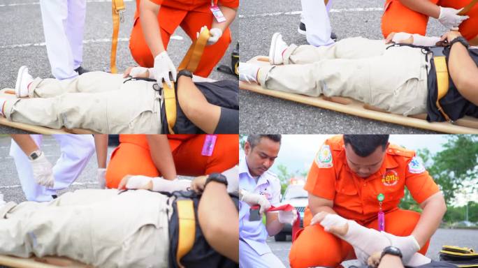 救护小组抢救一名车祸受害者的受伤人员