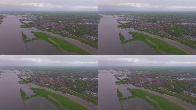 荷兰Gorinchem，黎明时宁静的河流、城镇和田野鸟瞰图。