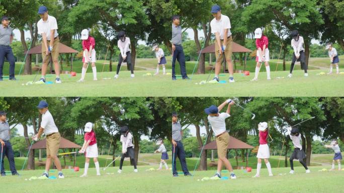 一男一女的亚洲孩子们正在高尔夫练习场由职业球员教打高尔夫球。培训俱乐部和司机。拿着高尔夫球包走向高尔