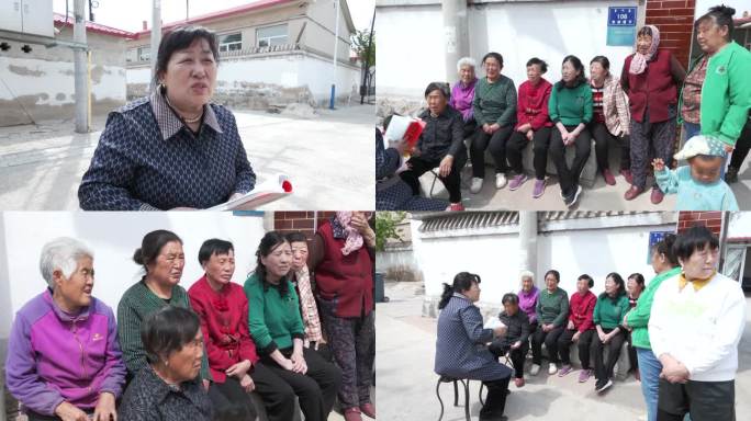 村妇女主任给村民讲政策村头开会