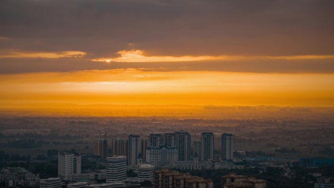 航拍城市日出太阳特写唯美城市日出耶稣光