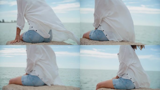 穿着休闲装的白人妇女在大海的映照下
