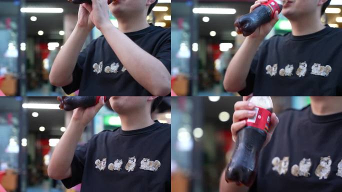 4K户外喝可乐的人