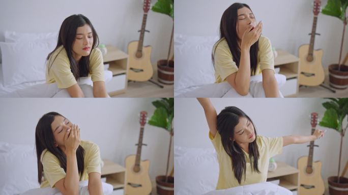 亚洲年轻困倦的女子在清晨从床上起床。疲惫迷人的女孩穿着睡衣感到心烦意乱，疲惫不堪，不想在家里的卧室里