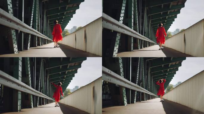 在城市的老火车桥上，穿着红色衣服的女人在玩滑板，女性滑板的城市背景