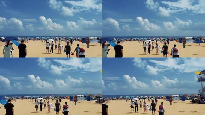 青岛银沙滩蓝天白云和游客